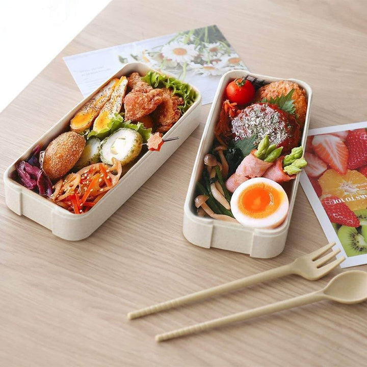 "3-lags bento madkasse i beige og lyserød, lufttæt, mikrobølge- og opvaskemaskinesikker, ideel til frokostopbevaring."