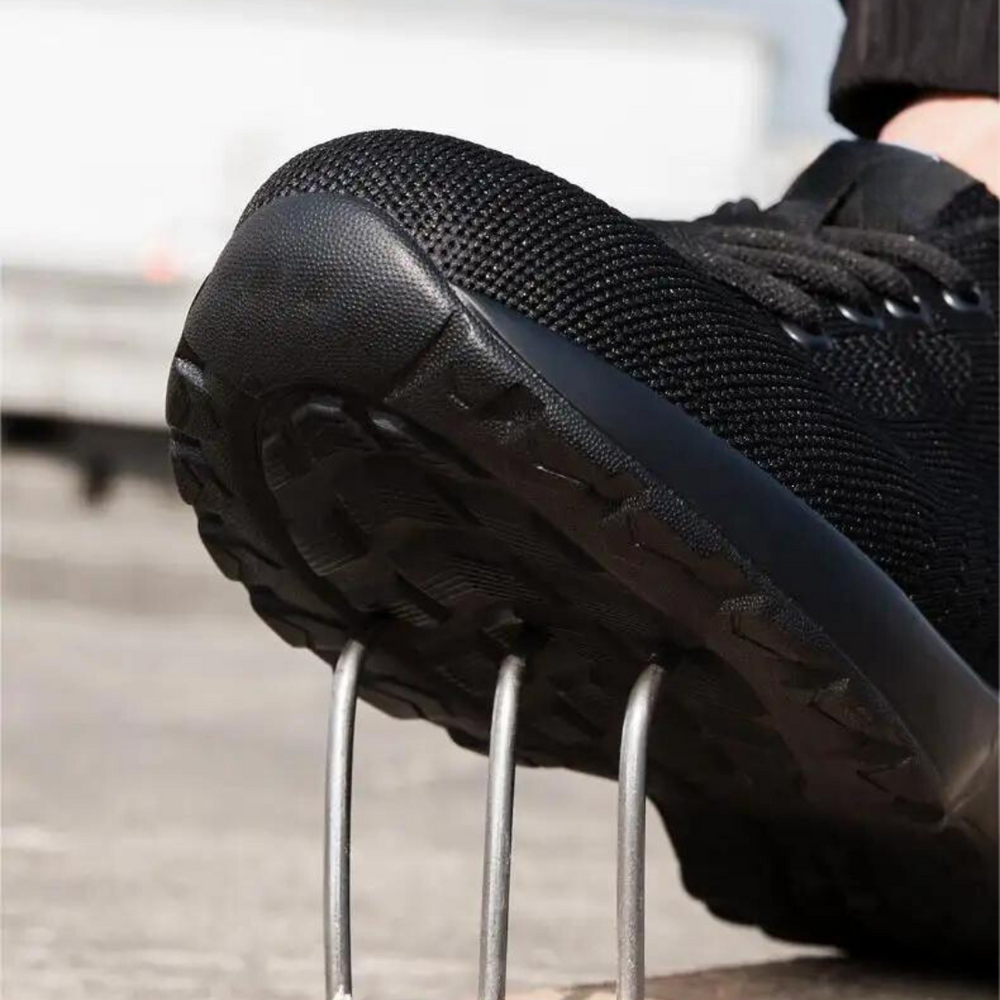 Air Cushion sikkerhedssko til mænd med stålkap, åndbart mesh-design og stødabsorberende sål til optimal komfort.