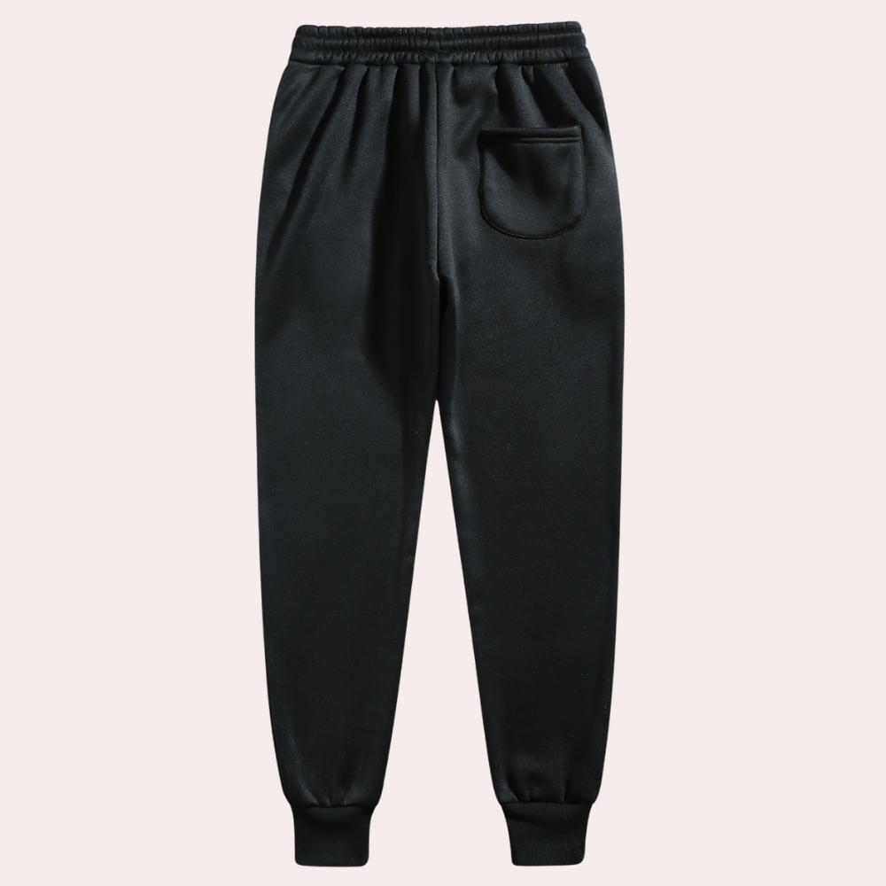 Mænds baggy joggingbukser i marineblå, forfra, med moderne og afslappet pasform.