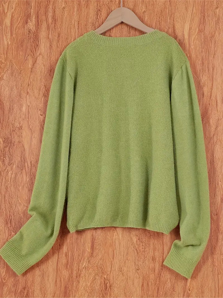 "Blød oversized uld strikcardigan til kvinder, elegant og komfortabel med afslappet pasform og praktiske lommer."