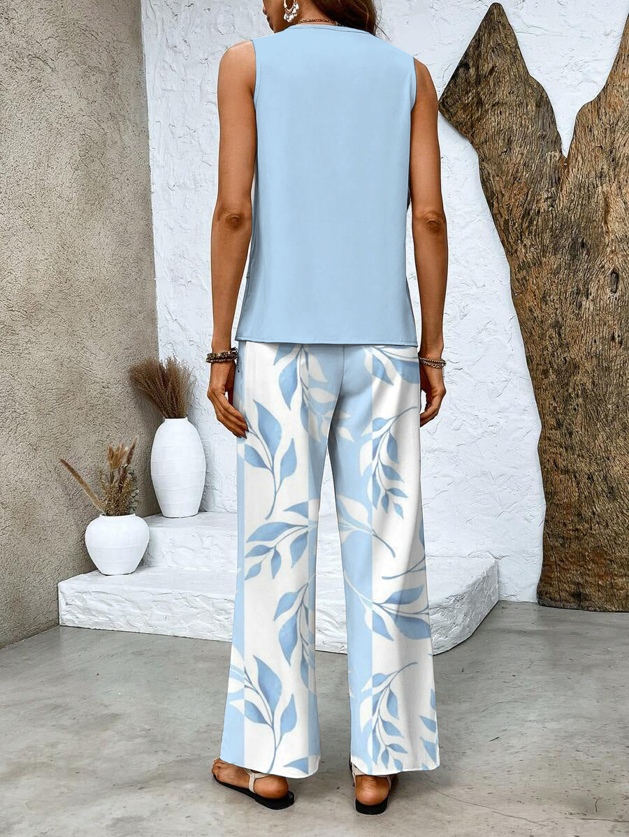 Blomstret top og buksesæt, elegant pasform. Kvindeoutfit perfekt til stil og komfort i hverdagen.