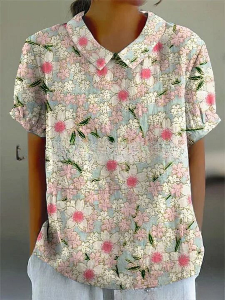 Elegant kvinde bluse med farverigt blomsterprint, perfekt til afslappede dage, tilbyder både stil og komfort.