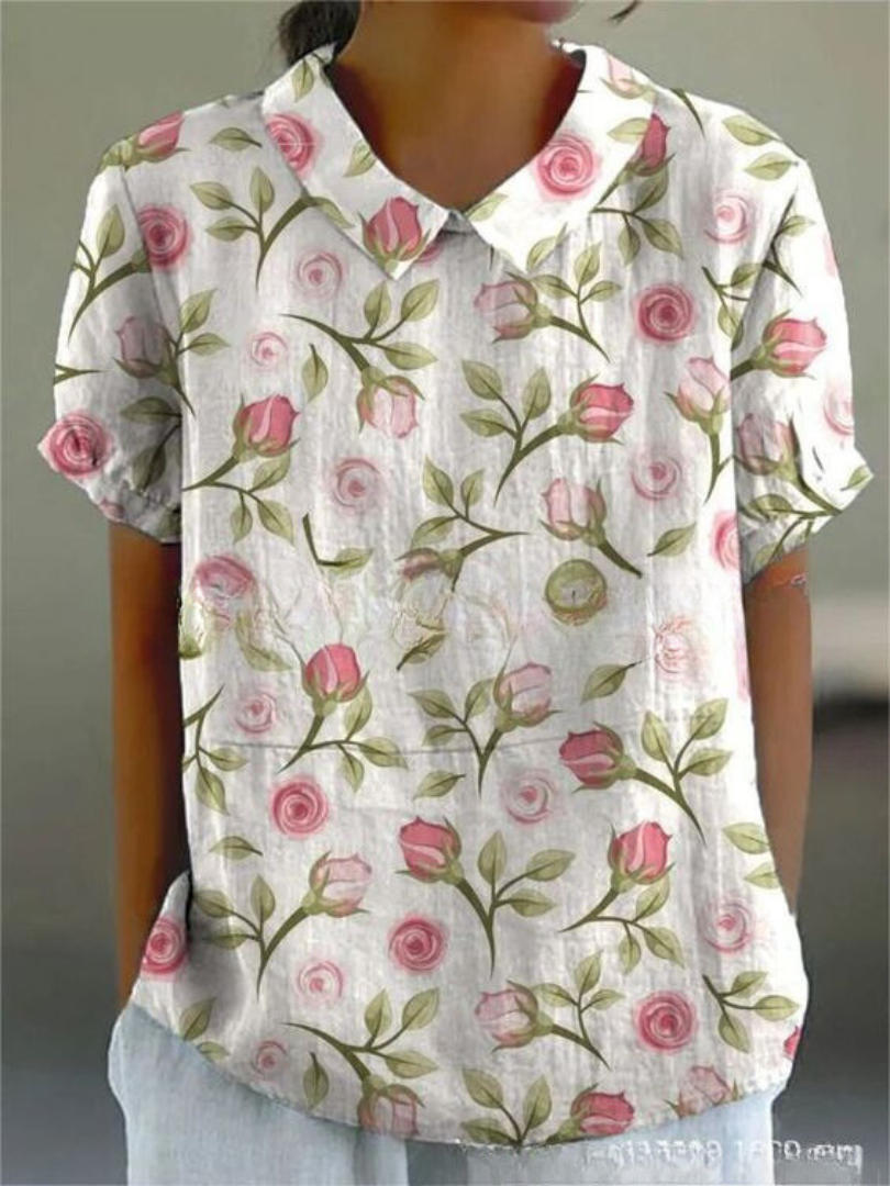 Elegant kvinde bluse med farverigt blomsterprint, perfekt til afslappede dage, tilbyder både stil og komfort.