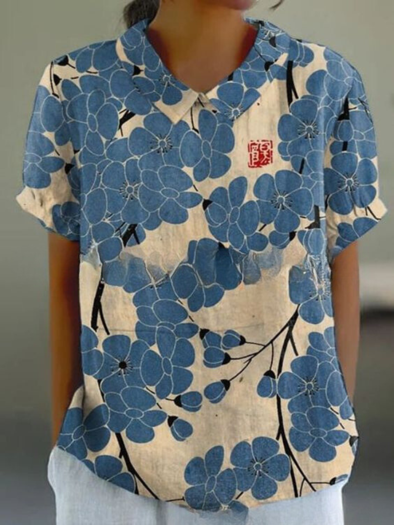 Elegant kvinde bluse med farverigt blomsterprint, perfekt til afslappede dage, tilbyder både stil og komfort.