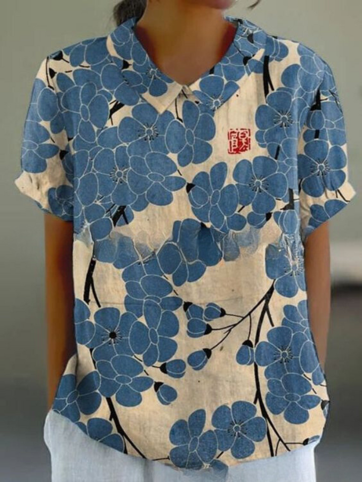 Elegant kvinde bluse med farverigt blomsterprint, perfekt til afslappede dage, tilbyder både stil og komfort.