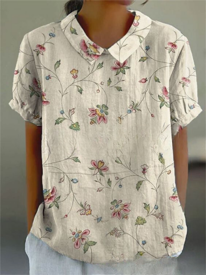 Elegant kvinde bluse med farverigt blomsterprint, perfekt til afslappede dage, tilbyder både stil og komfort.