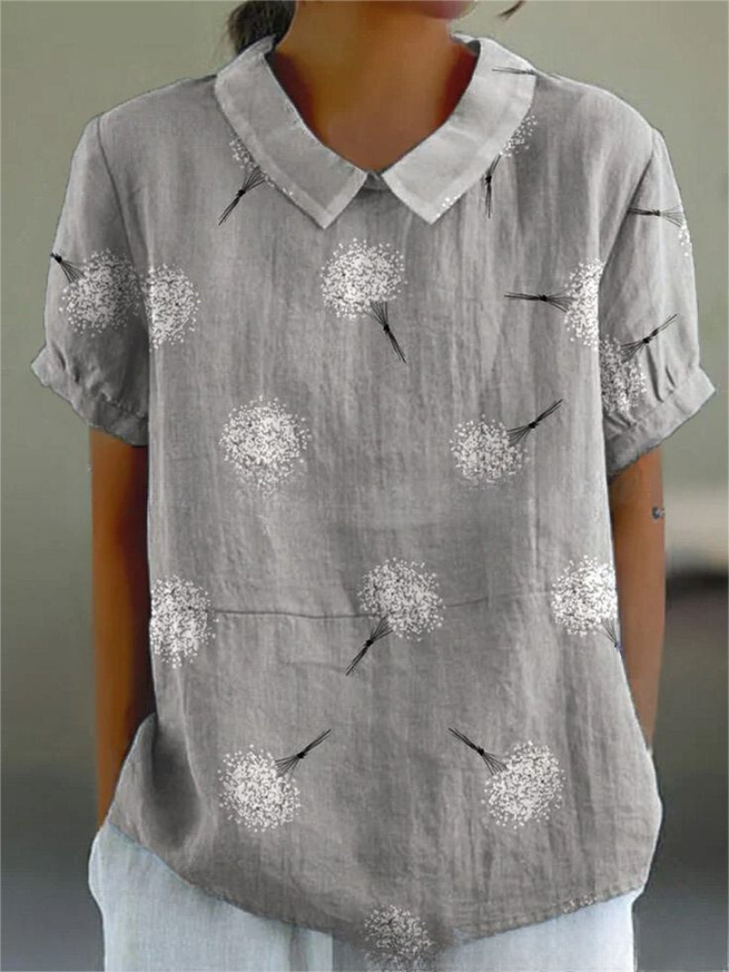 Elegant kvinde bluse med farverigt blomsterprint, perfekt til afslappede dage, tilbyder både stil og komfort.