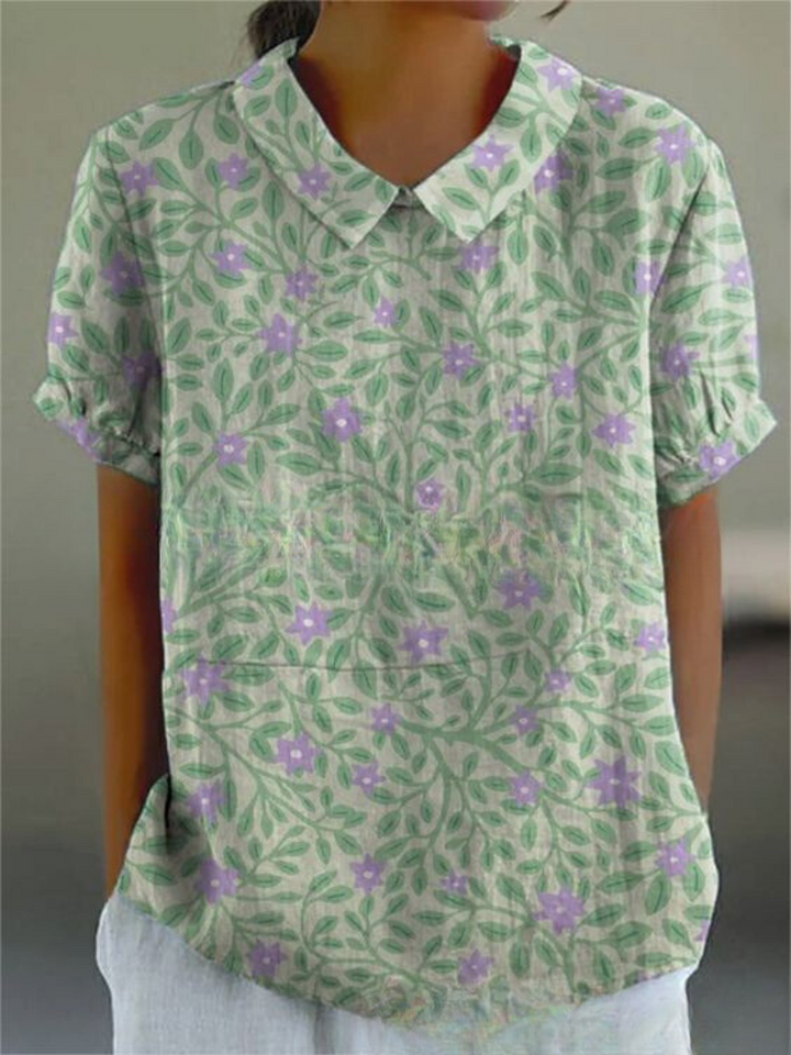Elegant kvinde bluse med farverigt blomsterprint, perfekt til afslappede dage, tilbyder både stil og komfort.