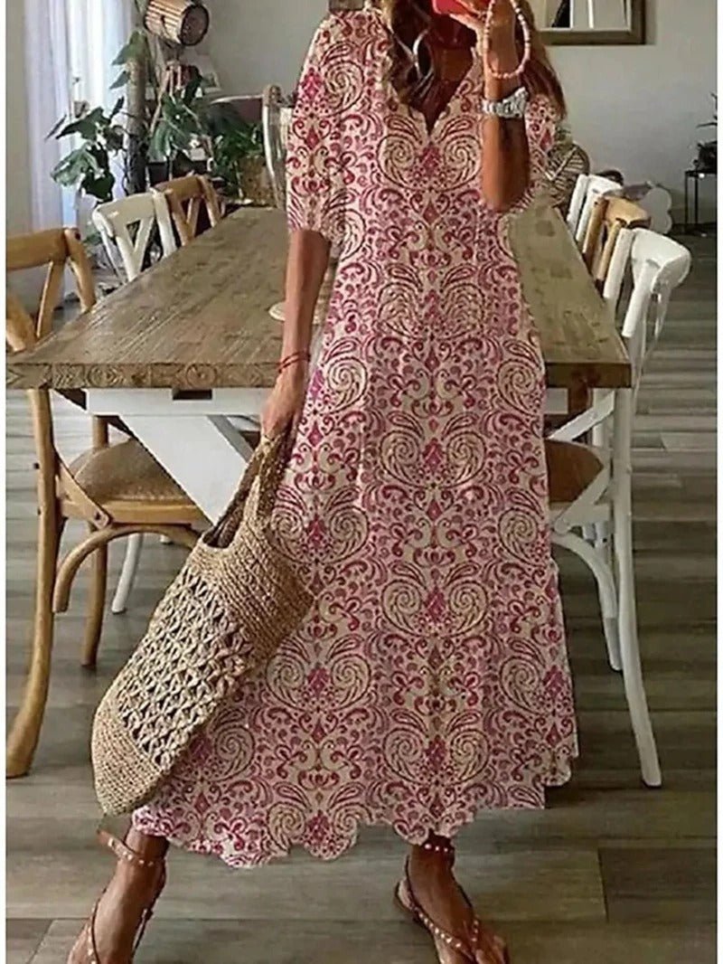 Blomstret dame maxi kjole med letvægtsstof, V-hals og korte ærmer. Ideel til afslappede lejligheder.