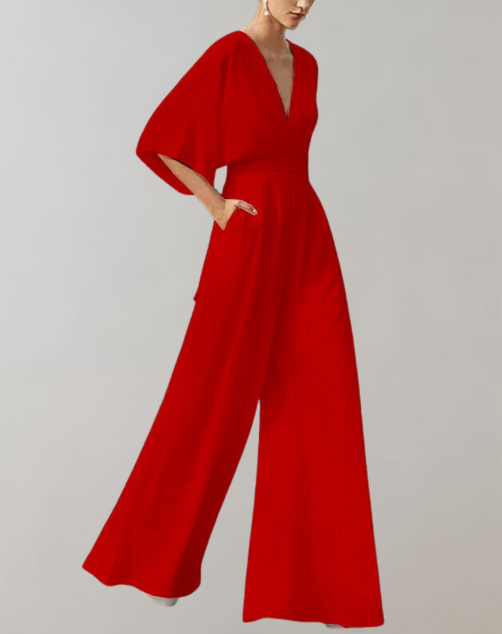 "Chik kvindejumpsuit i let stof med brede ben, elegant silhuet; perfekt til både hverdag og fest."