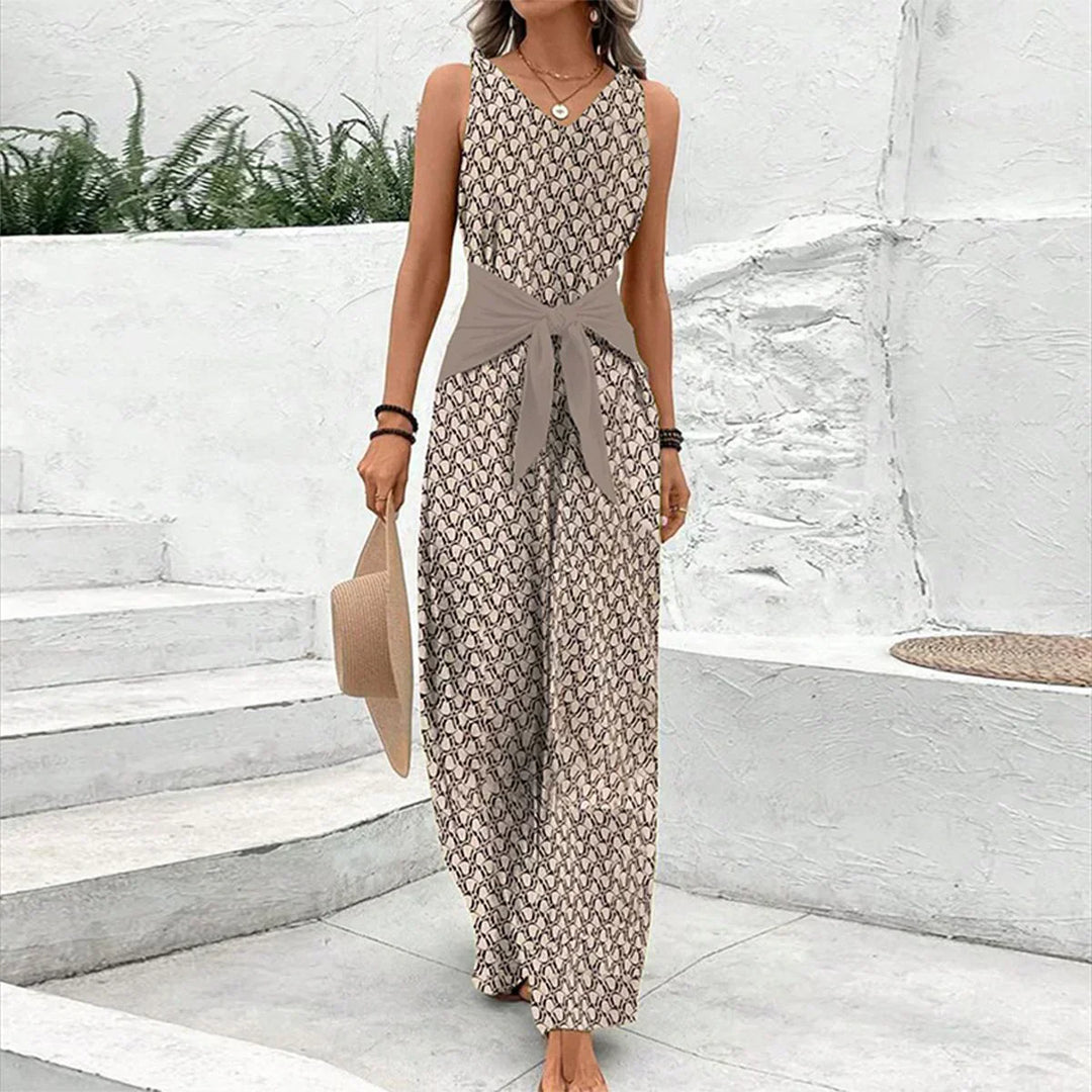 "Dame jumpsuit, ærmeløs V-hals, bred ben, bindebælte, geometrisk print, elegant og komfortabel til dag og aften."