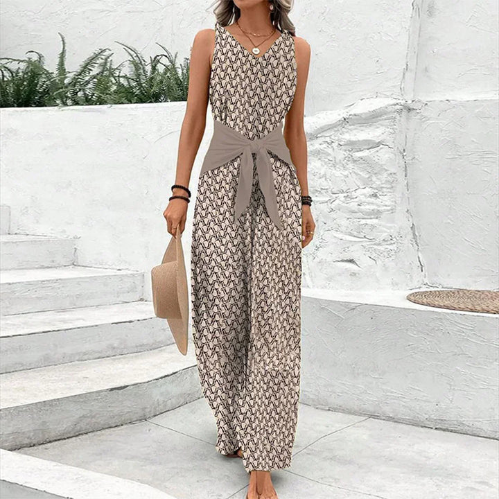 "Dame jumpsuit, ærmeløs V-hals, bred ben, bindebælte, geometrisk print, elegant og komfortabel til dag og aften."