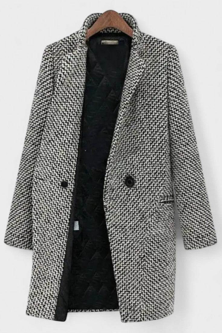 Klassisk grå damefrakke med markante revers og struktureret design. Elegant overtøj for dame mode.
