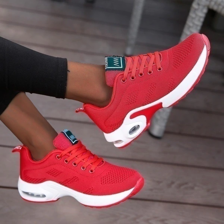 "Dameløbesko letvægts sneakers i hvid, lilla og pink med åndbart mesh og stødabsorbering, ideel til løb og gåture."