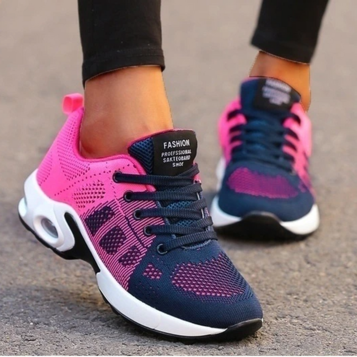 "Dameløbesko letvægts sneakers i hvid, lilla og pink med åndbart mesh og stødabsorbering, ideel til løb og gåture."