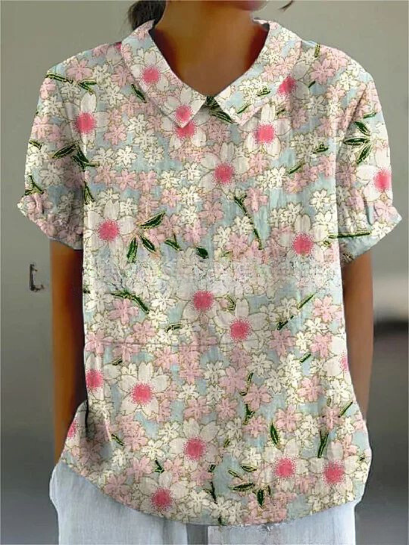 "Elegant Amanda Blomster Top i letvægtsstof, med smukt blomsterprint og afslappet pasform, perfekt til uformelle lejligheder.
