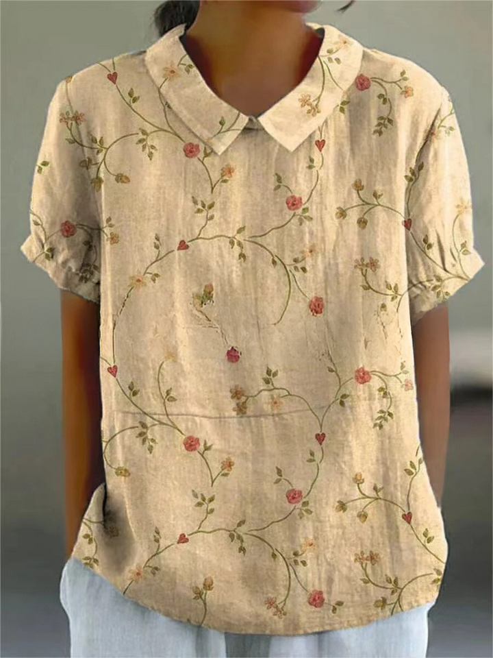 "Elegant Amanda Blomster Top i letvægtsstof, med smukt blomsterprint og afslappet pasform, perfekt til uformelle lejligheder.