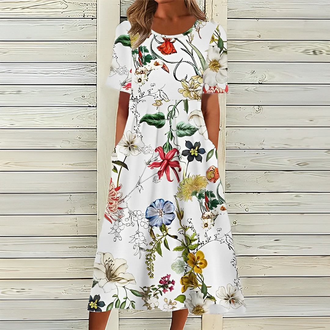 Kvinders elegant A-line MIDI-kjole med blomsterprint, korte ærmer og praktiske lommer, perfekt til sommer.