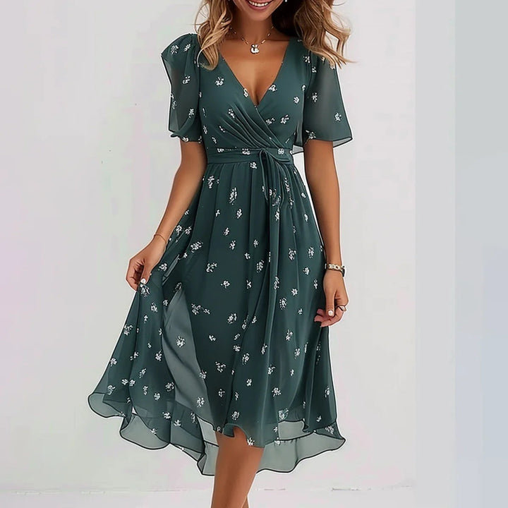 Elegant blomstret midi kjole til kvinder, yndefuld silhuet, tidløs stil til enhver anledning.