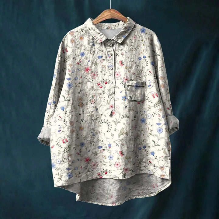 "Elegant blomsterskjorte med stribet design og bløde farvetoner, perfekt til både formelle og afslappede outfits."