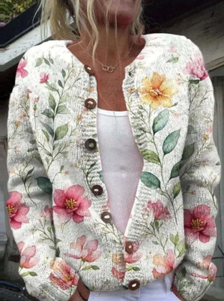 "Elegant blomstrede strikjakke til damer, front view, med farverige blomstermønstre, ideel til både arbejds- og fritidsbrug."