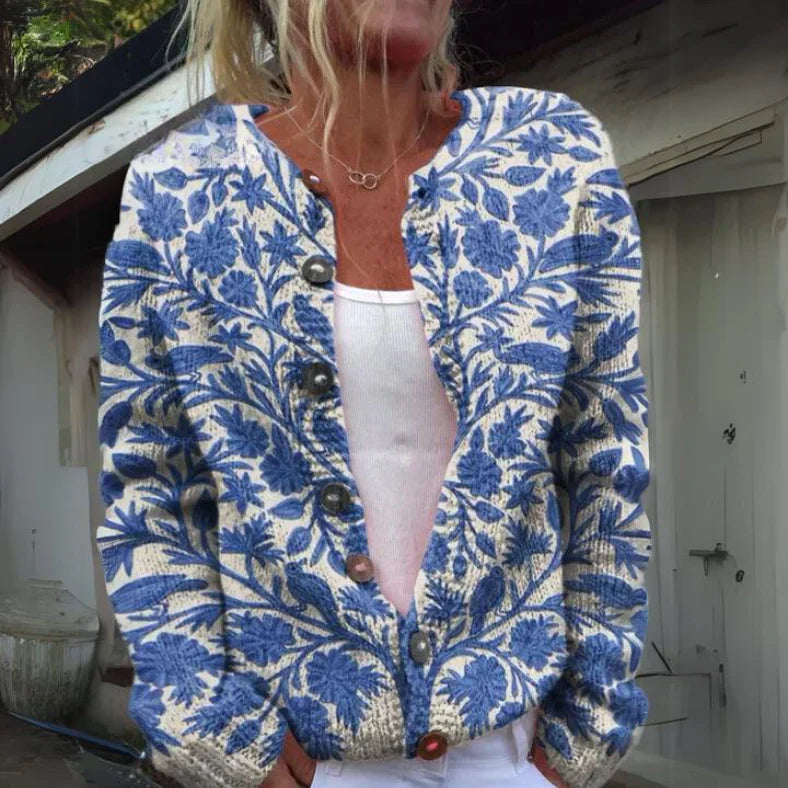 "Elegant blomstrede strikjakke til damer, front view, med farverige blomstermønstre, ideel til både arbejds- og fritidsbrug."