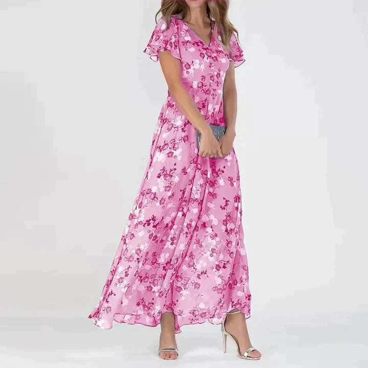 "Elegant blomstret maxi kjole med V-hals og flydende silhuet, ideel til kvinder, der søger et moderne og feminint look."