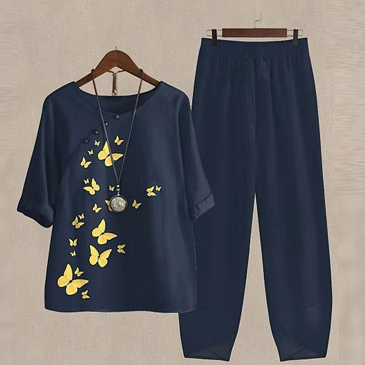 Kvinders elegant bluse og bukse sæt med moderne print, perfekt til både arbejde og fritid.