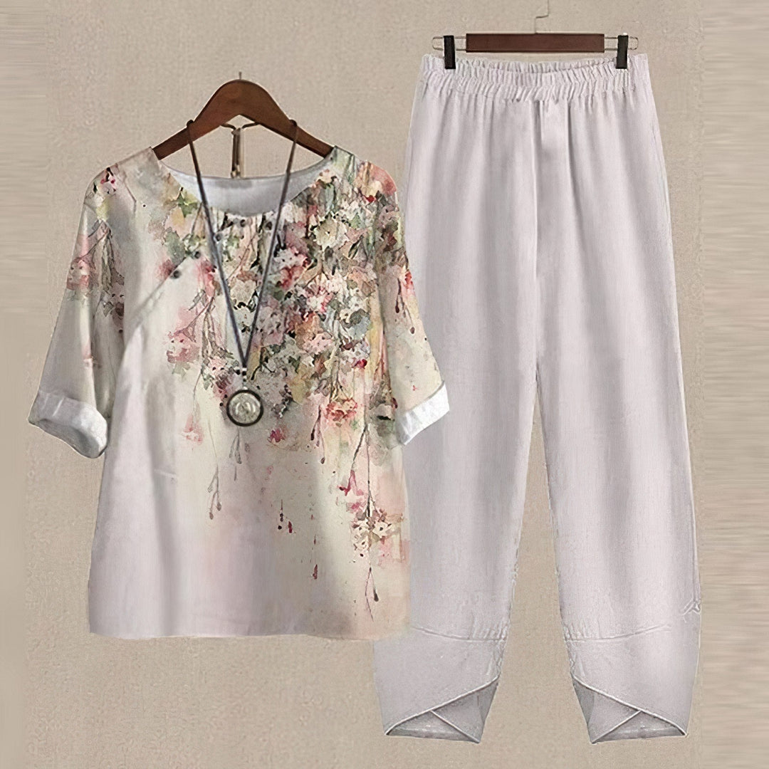 Kvinders elegant bluse og bukse sæt med moderne print, perfekt til både arbejde og fritid.