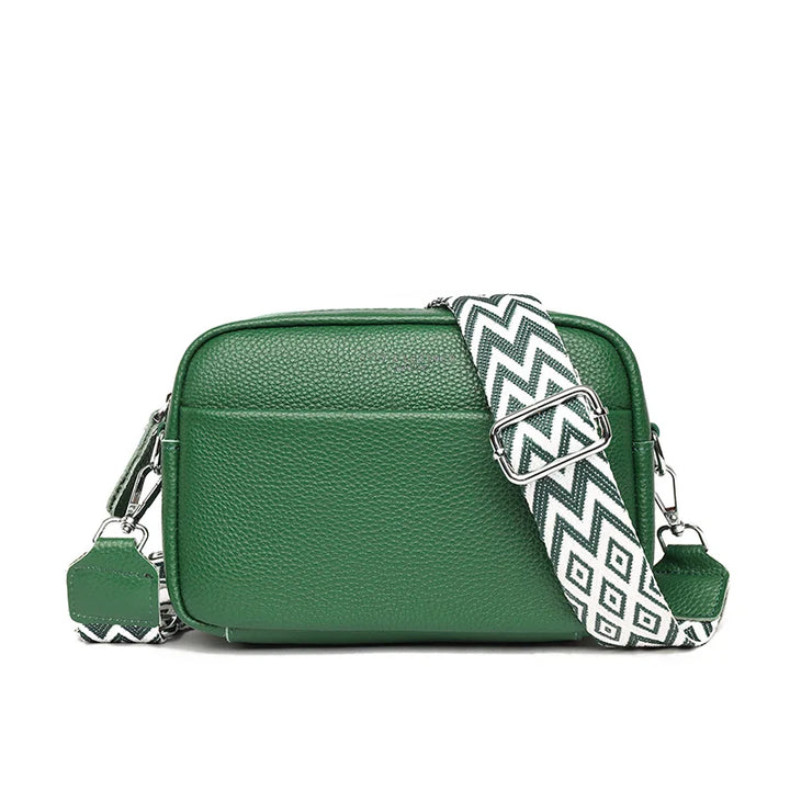 "Elegant crossbody-taske i ægte læder til kvinder; alsidigt design med justerbar rem og flere rum; passer til enhver stil."