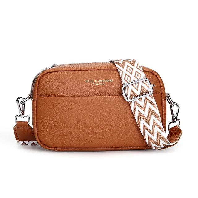 "Elegant crossbody-taske i ægte læder til kvinder; alsidigt design med justerbar rem og flere rum; passer til enhver stil."