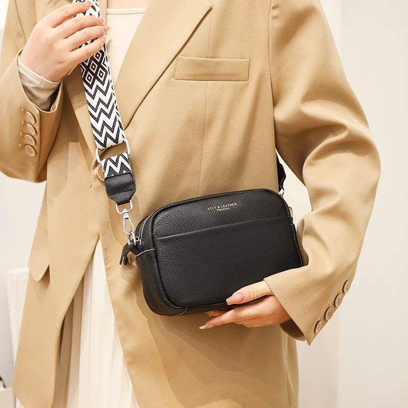 "Elegant crossbody-taske i ægte læder til kvinder; alsidigt design med justerbar rem og flere rum; passer til enhver stil."