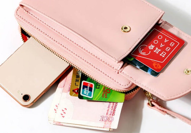 Elegant crossbody taske med guldfarvede beslag og justerbar rem, ideel til hverdagsbrug og festlige lejligheder.