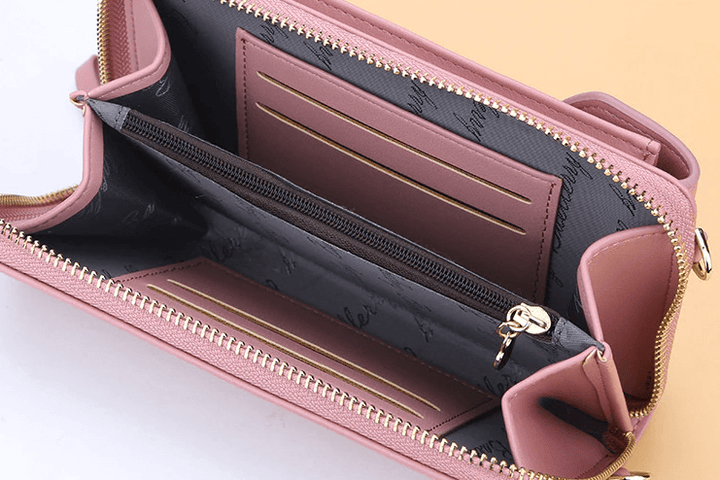 Elegant crossbody taske med guldfarvede beslag og justerbar rem, ideel til hverdagsbrug og festlige lejligheder.