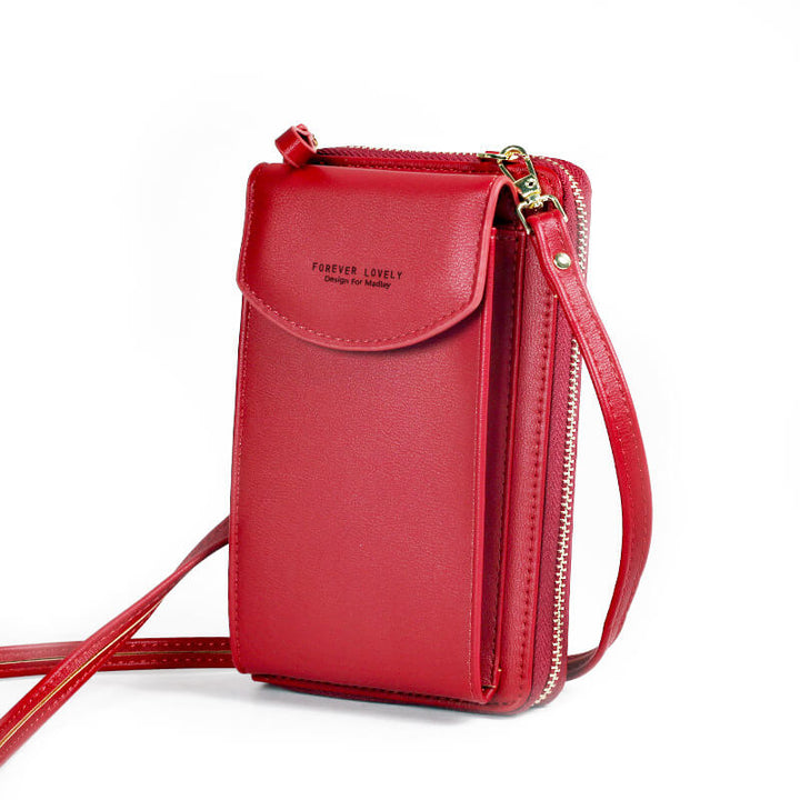 Elegant crossbody taske med guldfarvede beslag og justerbar rem, ideel til hverdagsbrug og festlige lejligheder.