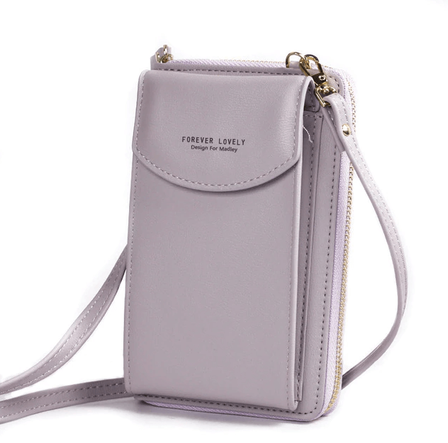 Elegant crossbody taske med guldfarvede beslag og justerbar rem, ideel til hverdagsbrug og festlige lejligheder.