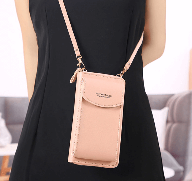 Elegant crossbody taske med guldfarvede beslag og justerbar rem, ideel til hverdagsbrug og festlige lejligheder.