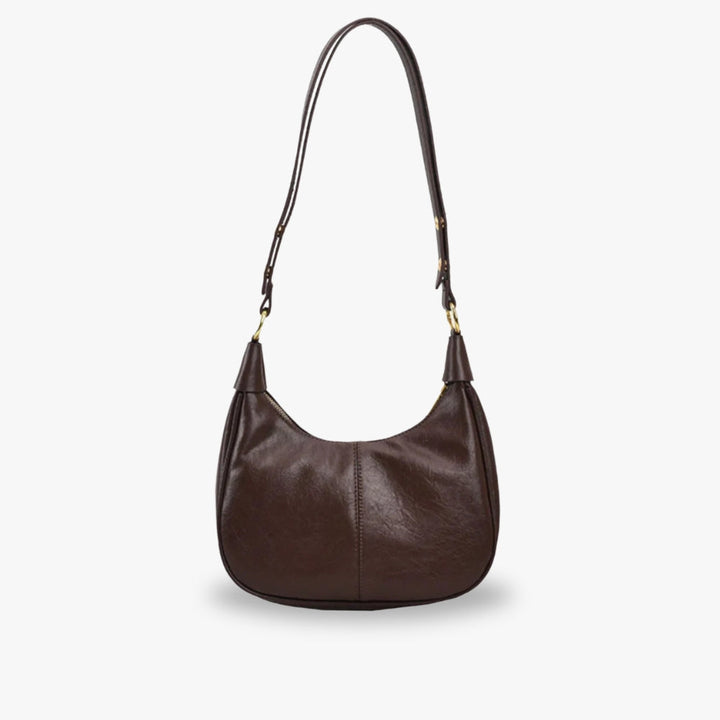Elegant crossbodytaske med justerbar rem og guldfarvede detaljer, ideel til hverdagsbrug.