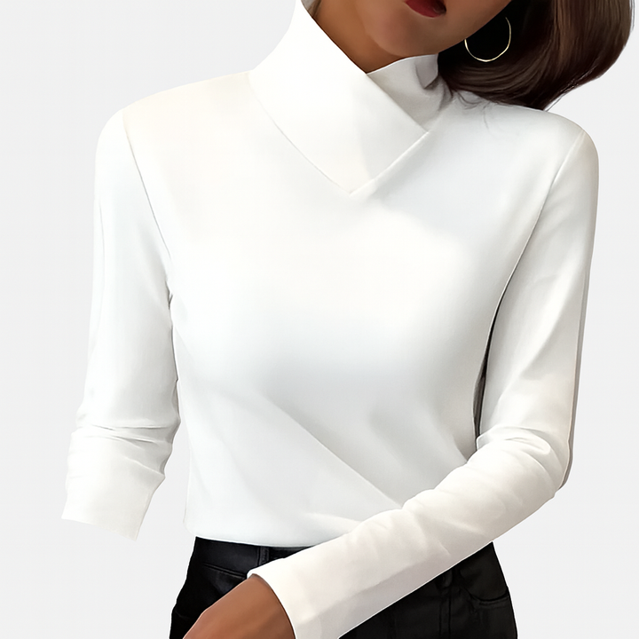 Elegant dame bluse med høj hals og tætsiddende pasform. Perfekt basisbluse til hverdag og aftenbrug.