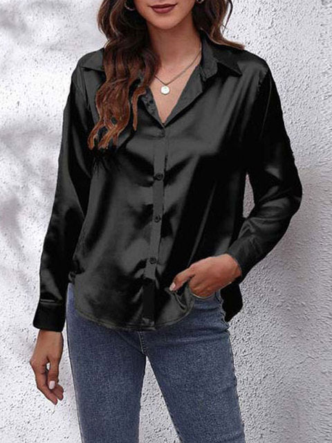 Dameskjorte med unik frontknude og elegant glans. En feminin og trendy langærmet bluse til mange anledninger.