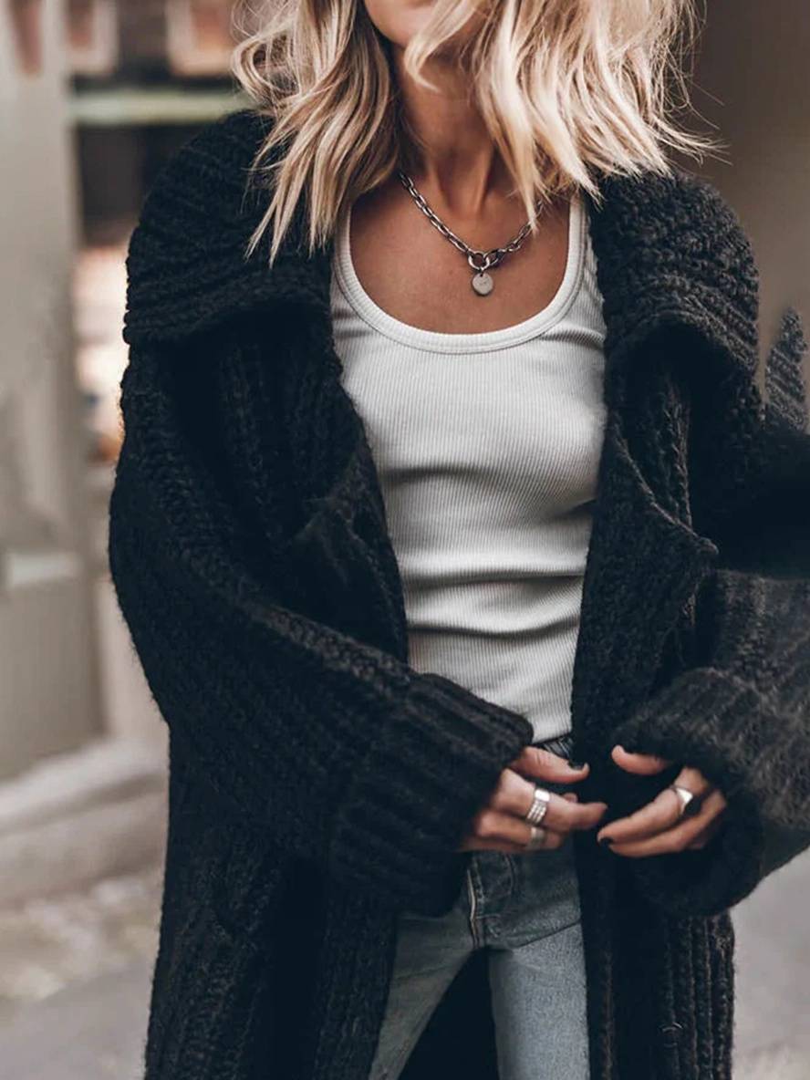 Afslappet sort cardigan til kvinder, med knapper og oversized pasform, til enhver lejlighed.