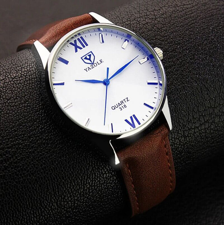 Elegant herreur med sort armbånd og romertalsskive, perfekt til både business og fritid.