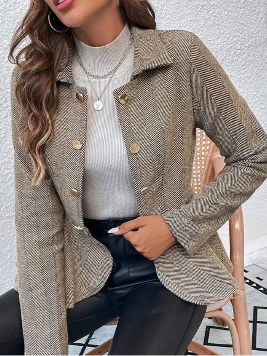 Sort elegant blazer med peplum og chevron, ideel til hverdag eller fest.