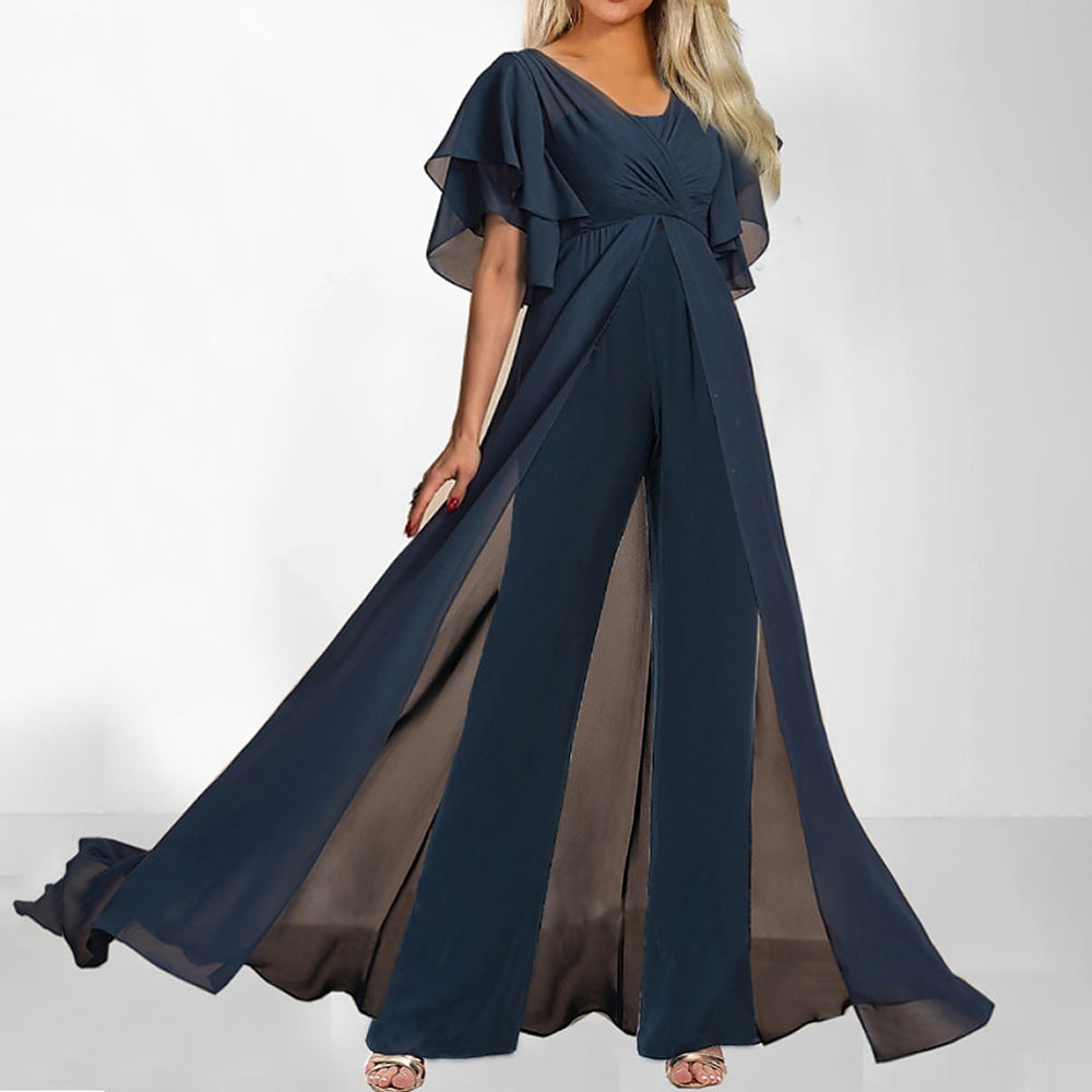 Elegant marineblå dame buksedragt med flagrende ærmer og vide ben til fest. Perfekt aftenkjole alternativ.