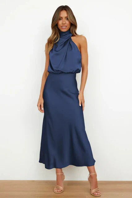 Moderne og elegant skulderfri midikjole til kvinder, perfekt som festkjole eller bryllupsgæst outfit.