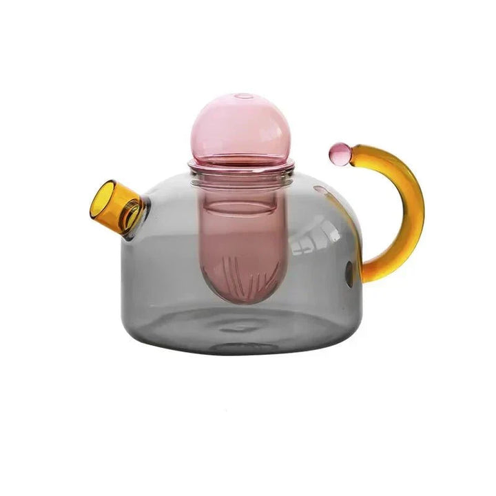 Det elegante tekande og krus sæt, fremstillet af holdbart glas, giver en stilfuld teoplevelse hver gang.