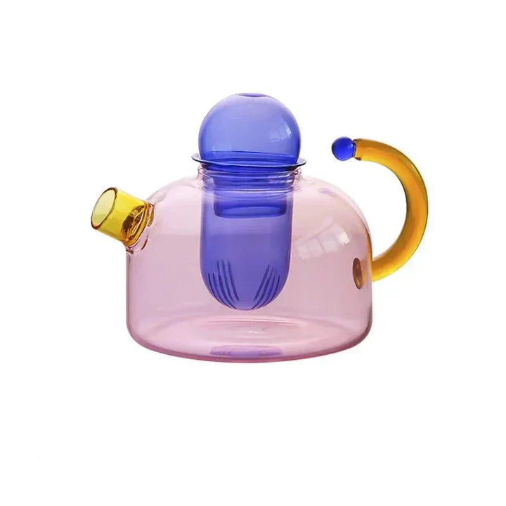 Tekande med integreret filter til nem brygning af løs te. Del af et moderne, elegant tesæt i glas.