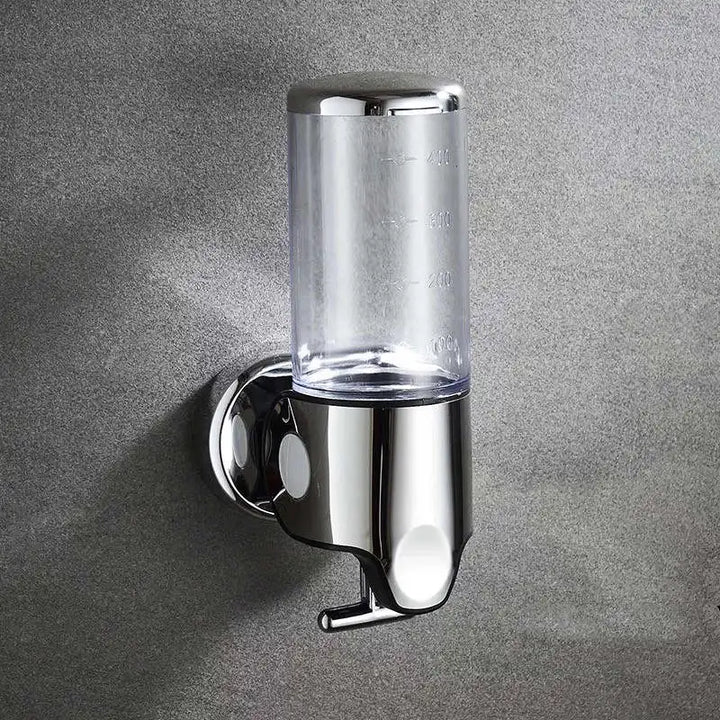 "Elegant vægmonteret sæbedispenser med dobbelt rum, minimalistisk design, gennemsigtige sektioner for nemt overblik."
