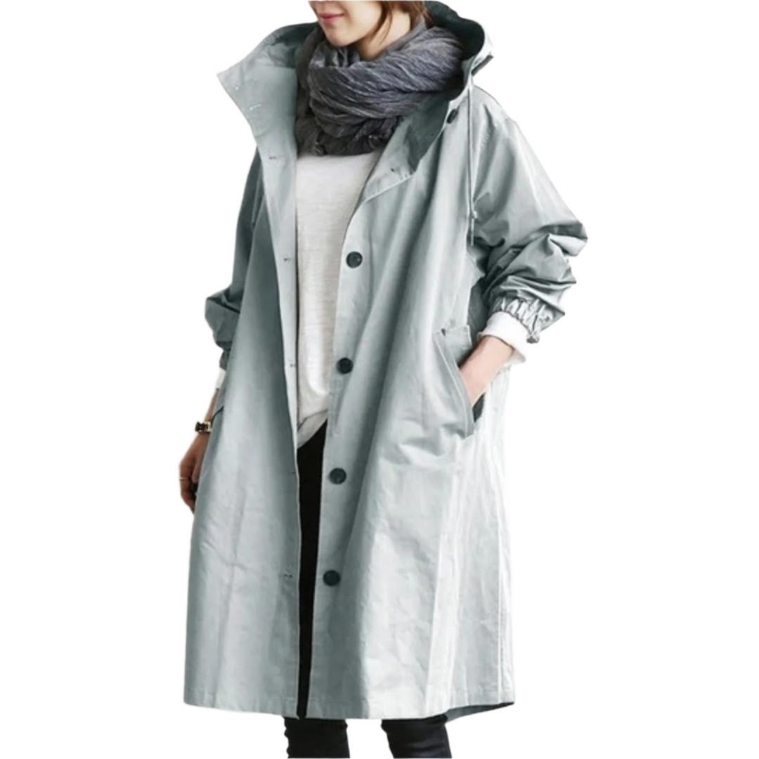 Elegant, vandafvisende trenchcoat til kvinder i klassisk design, med bælte og lommer, velegnet til overgangsvejr.