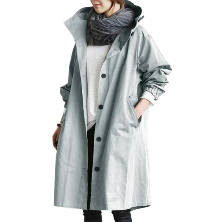 Elegant, vandafvisende trenchcoat til kvinder i klassisk design, med bælte og lommer, velegnet til overgangsvejr.